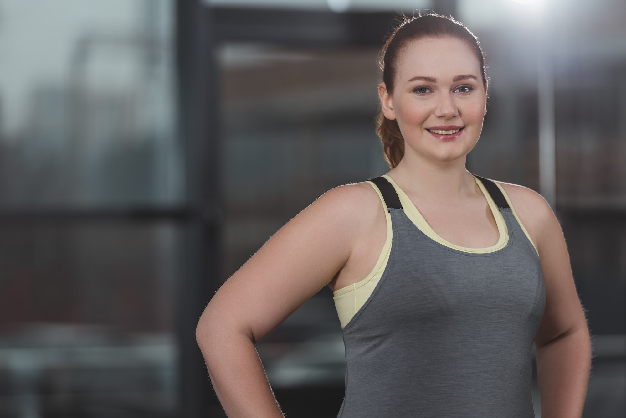 portrait-of-obese-girl-smiling-in-gym